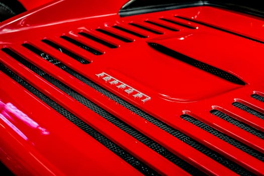 Detailed shot of a Ferrari emblem on a classic red